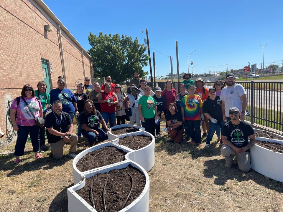 Educators gathered outside in school garden in San Antonio at kickoff event on September 28th, 2024.